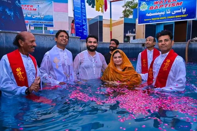 Believers being baptised on baptism day