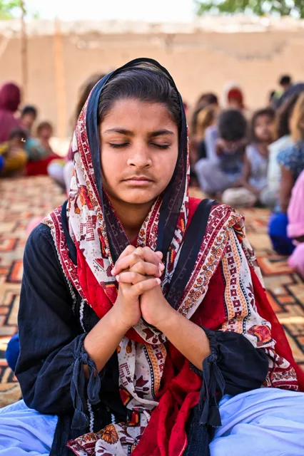 A child in a quiet moment of prayer