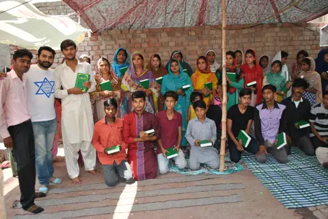 Holy Bible distribution & village fellowship