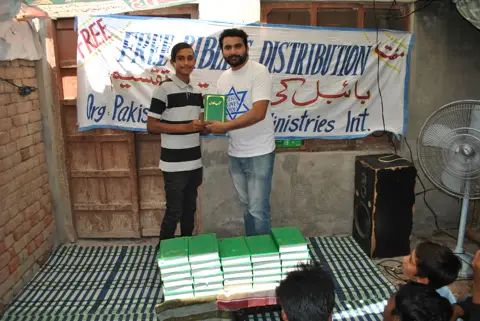 Holy Bible distribution & village fellowship