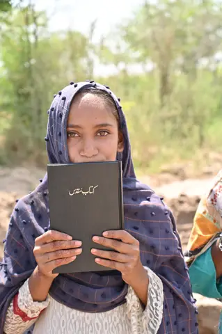 Holy Bible distribution & village fellowship